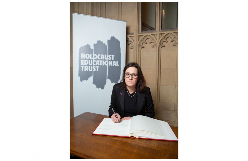 Rebecca signing the Holocaust Educational Trust Book of Commitment 23