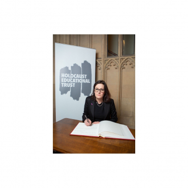 Rebecca signing the Holocaust Educational Trust Book of Commitment 23